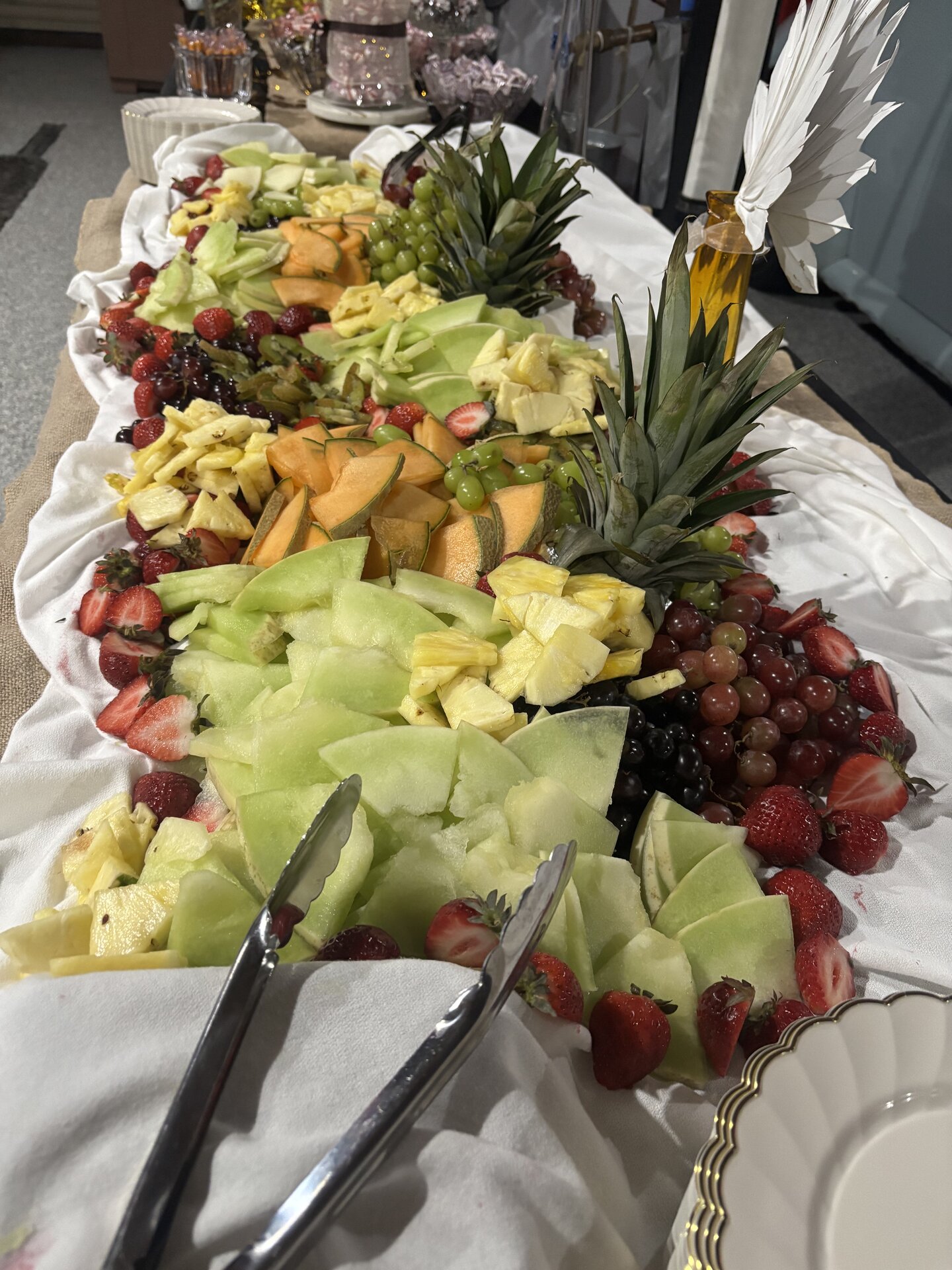 Fresh fruit spread with pineapple, melon, and berries